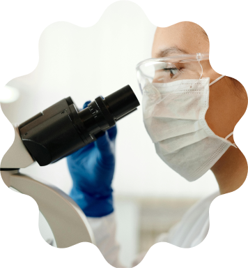 Scientists looking through a microscope