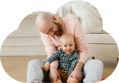 Adult with infant smiling