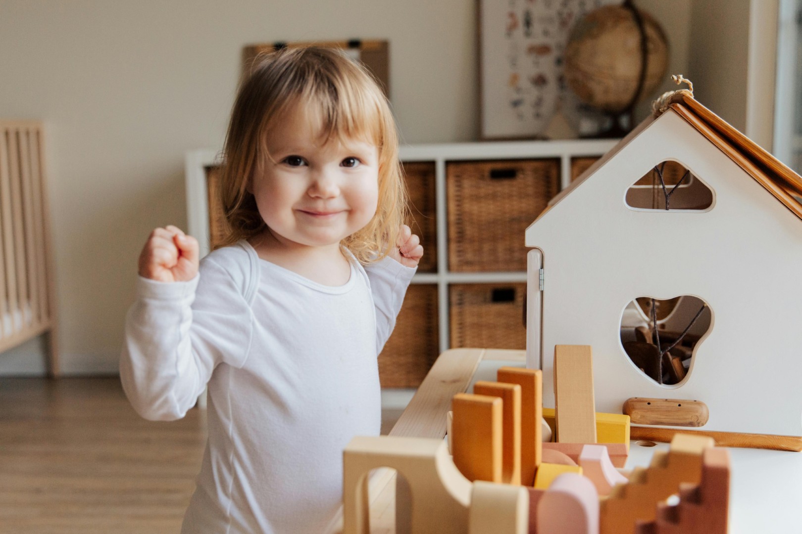 Young child playing with wooden blocks