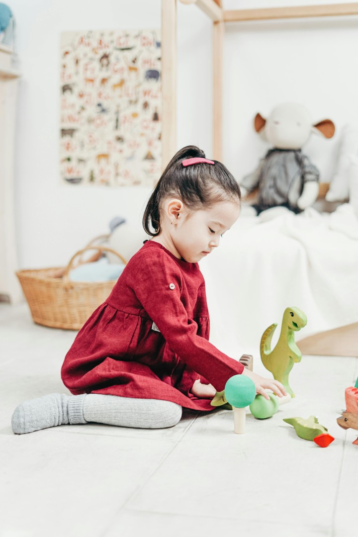 Young child playing with wooden blocks