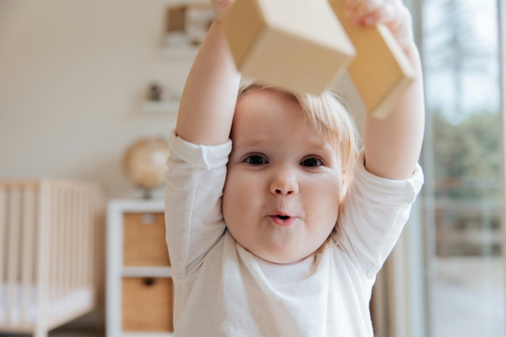 Young child playing with wooden blocks