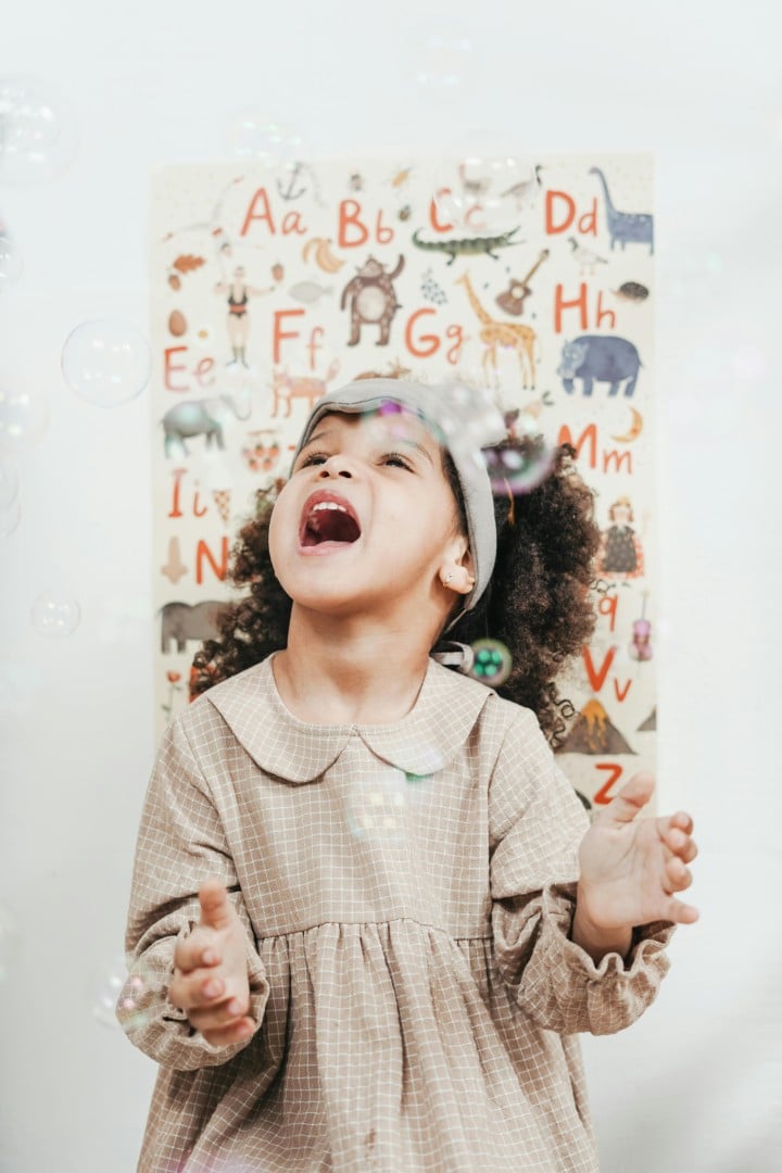 Child playing with bubbles