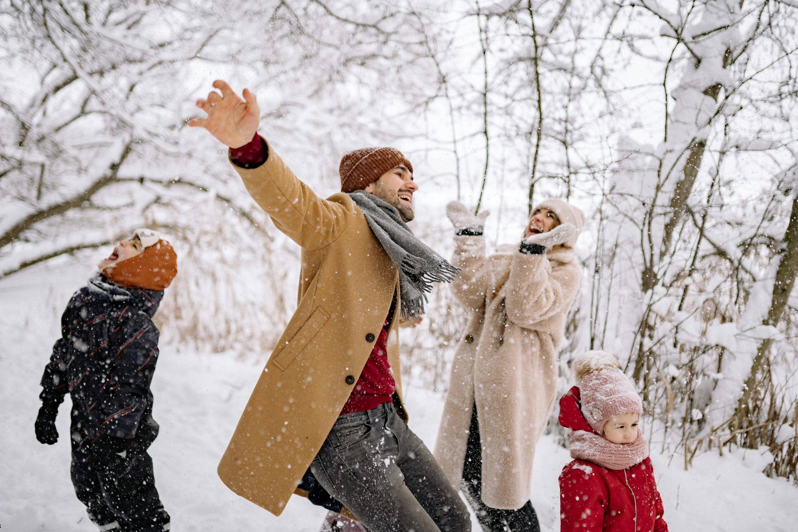 Family playing in the snow